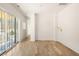 Bright bedroom with hardwood floors and private balcony at 1180 Lupo Loop, Chattahoochee Hills, GA 30268