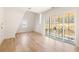 Bedroom with hardwood floors and private balcony at 1180 Lupo Loop, Chattahoochee Hills, GA 30268