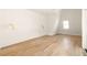 Bright bedroom with hardwood floors and dormer window at 1180 Lupo Loop, Chattahoochee Hills, GA 30268