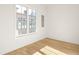 Bright bedroom with hardwood floors and large window at 1180 Lupo Loop, Chattahoochee Hills, GA 30268
