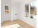 Spacious bedroom with hardwood floors and large window at 1180 Lupo Loop, Chattahoochee Hills, GA 30268