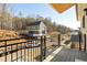 View of houses and wooded area from a balcony at 1180 Lupo Loop, Chattahoochee Hills, GA 30268