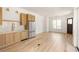Modern kitchenette with light oak cabinets and stainless steel appliances at 1180 Lupo Loop, Chattahoochee Hills, GA 30268