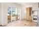 Living area with hardwood floors and sliding glass doors to backyard at 1180 Lupo Loop, Chattahoochee Hills, GA 30268