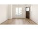 Bright living room with hardwood floors and large windows at 1180 Lupo Loop, Chattahoochee Hills, GA 30268