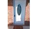 White front door with oval glass window and doormat at 6398 Shadow Sq, Lithonia, GA 30058