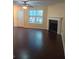 Spacious living room with hardwood floors and fireplace at 6398 Shadow Sq, Lithonia, GA 30058