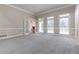 Living room with hardwood floors, fireplace and French doors at 1510 Natchez Way, Grayson, GA 30017