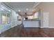 Kitchen with white cabinets, granite counters, and island at 1510 Natchez Way, Grayson, GA 30017