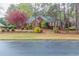 Brick home with landscaped yard and mature trees at 1510 Natchez Way, Grayson, GA 30017