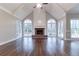 Spacious living room with hardwood floors, fireplace, and vaulted ceiling at 1510 Natchez Way, Grayson, GA 30017