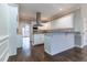 Kitchen with white cabinets, granite counters and stainless steel appliances at 1510 Natchez Way, Grayson, GA 30017