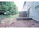 Small patio and grassy backyard with wooden fence at 2158 Executive Dr, Duluth, GA 30096