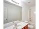 Bathroom with single vanity, shower/tub combo, and toilet at 2158 Executive Dr, Duluth, GA 30096