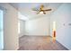 Spacious bedroom with carpet, ceiling fan and access to bathroom at 2158 Executive Dr, Duluth, GA 30096