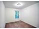 Bright bedroom with neutral walls and carpeted floors at 2158 Executive Dr, Duluth, GA 30096