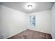 Bright bedroom with neutral walls and carpeted floors at 2158 Executive Dr, Duluth, GA 30096