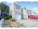 Two-story townhome with attached garage and landscaping at 2158 Executive Dr, Duluth, GA 30096