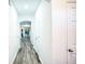 Bright and spacious hallway with hardwood floors and access to multiple rooms at 2158 Executive Dr, Duluth, GA 30096