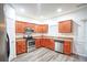 Modern kitchen with stainless steel appliances and wood cabinets at 2158 Executive Dr, Duluth, GA 30096