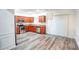 Kitchen with wood cabinets, stainless steel appliances and dining area at 2158 Executive Dr, Duluth, GA 30096