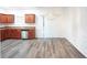 Kitchen with wood cabinets, stainless steel appliances and dining area at 2158 Executive Dr, Duluth, GA 30096