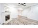 Living room with fireplace, wood-look floors, and ceiling fan at 2158 Executive Dr, Duluth, GA 30096