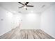 Bright living room with wood-look floors and ceiling fan at 2158 Executive Dr, Duluth, GA 30096