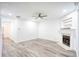 Bright living room features hardwood floors, fireplace and ceiling fan at 2158 Executive Dr, Duluth, GA 30096