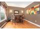 Home wet bar with hardwood floors and stylish barstools at 326 Vinings Vintage Cir, Mableton, GA 30126