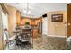 Kitchen with light wood cabinets, granite counters and a breakfast nook at 326 Vinings Vintage Cir, Mableton, GA 30126