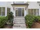 Gray front door with stone steps leading to the entrance of the home at 4305 E Summit Ct, Marietta, GA 30066