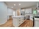 Modern kitchen with white cabinets, stainless steel appliances, and a large island at 4305 E Summit Ct, Marietta, GA 30066