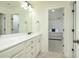 Bathroom with double vanity and view of bedroom at 205 Yosemite Ter, Hampton, GA 30228