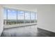 Spacious living room with hardwood floors and floor-to-ceiling windows offering stunning city views at 3630 Peachtree Ne Rd # 3106, Atlanta, GA 30326