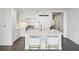 Modern white kitchen with marble island and breakfast bar at 3630 Peachtree Ne Rd # 3106, Atlanta, GA 30326