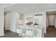 Modern white kitchen with marble island and breakfast bar at 3630 Peachtree Ne Rd # 3106, Atlanta, GA 30326