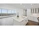 Modern white kitchen with marble island and city views at 3630 Peachtree Ne Rd # 3106, Atlanta, GA 30326