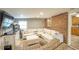 Finished basement with sectional sofa and access to kitchen at 680 Sherwood Dr, Jonesboro, GA 30236