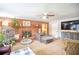 Living room with brick fireplace, large TV, and comfortable seating at 680 Sherwood Dr, Jonesboro, GA 30236