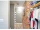 Simple bathroom with shower, toilet, and exposed brick wall at 680 Sherwood Dr, Jonesboro, GA 30236