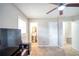 Bright bedroom with ceiling fan and access to a full bathroom at 680 Sherwood Dr, Jonesboro, GA 30236