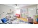 Cozy living room featuring hardwood floors, comfortable seating, and tasteful decor at 680 Sherwood Dr, Jonesboro, GA 30236