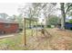 Spacious backyard with playset and mature trees at 680 Sherwood Dr, Jonesboro, GA 30236