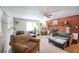 Bright living room with brick fireplace and comfortable seating at 680 Sherwood Dr, Jonesboro, GA 30236