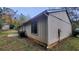 Side and rear exterior of the house, showing a window and a side door at 4912 Bayside Ct, Stone Mountain, GA 30088