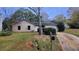 Front exterior of a one-story home with attached garage, driveway, and mailbox at 4912 Bayside Ct, Stone Mountain, GA 30088