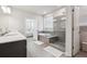 Modern bathroom with double vanity, large shower, and soaking tub at 4011 Fallen Leaf Ct, Kennesaw, GA 30152