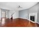 Hardwood floor living room with fireplace and staircase at 3102 Briaroak Dr, Duluth, GA 30096