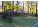 Large backyard with shed, trees, and a partially visible fence at 2159 Sandown Dr, Lawrenceville, GA 30043